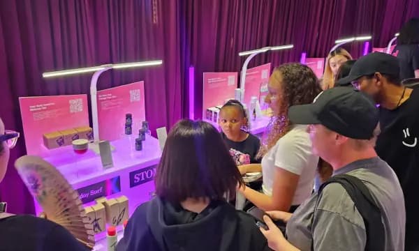 Visitors exploring K-Beauty sampling stations
