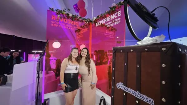 Visitors at the Get Your K-Glam photo booth