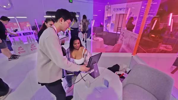 AI skin analysis experience station at the All That Glow zone